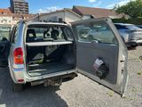 a car that has its door open in a parking lot