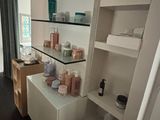 a room that has a shelf with various items on it