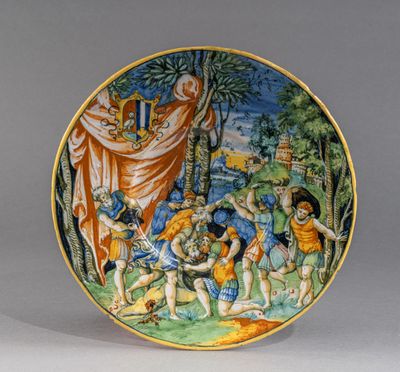 une image représentant une assiette sur laquelle est peinte une scène biblique