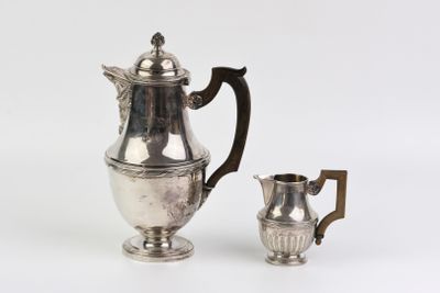 silver plated coffee pot and creamer on a white background
