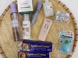 a wicker tray with various skin care products on it