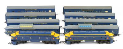 four blue and yellow train cars sitting next to each other