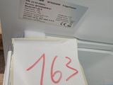 a piece of paper on top of a freezer