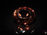 an image of an orange diamond on a black surface