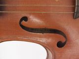 a close up of a violin with a bow on it