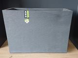 a large gray box with a green label on it