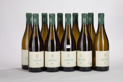 six bottles of wine are lined up in a row on a white surface