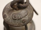 a close up of a metal object on a white surface
