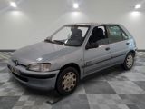 a silver car that is sitting on a checkered floor