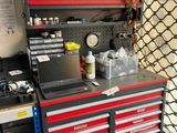 a workbench with a laptop on top of it