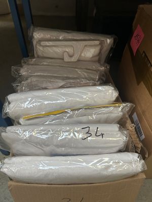 boxes of toilet paper are stacked on top of each other in a warehouse