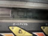 a close up of a parking meter with stickers on it