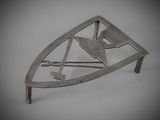 a close up of a metal object on a white surface