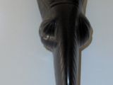 a black animal head mounted on the wall