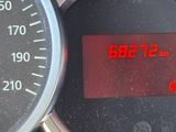 a close up of a car ' s dashboard with a speedometer