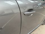 a car door handle with a sticker on it
