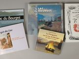 four books that are sitting on a table