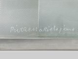 a close up of a metal object on a white surface