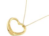 a gold heart shaped pendant with a chain on a white background