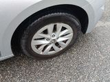 a close up of a car ' s tire on the pavement