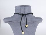 a close up of a mannequin with a necklace on it