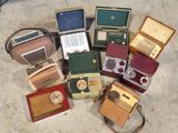 a lot of old radio ' s that are on the floor
