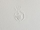 a close up of a white paper with a logo on it