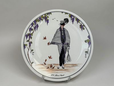 a plate with a picture of a man holding a tennis racquet