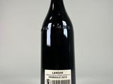 a bottle of wine that is sitting on a table