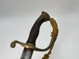 an image of a close up of a sword on a white surface