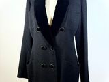 the jacket is black and has a black lapel collar