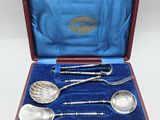 four spoons and two spoons in a case
