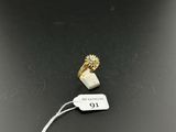 a close up of a ring on a string with a price tag