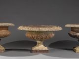 three vases sitting next to each other on a table