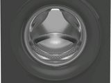 a washing machine with the door open and the front door open