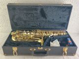 a saxophone that is in a case on a table