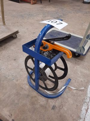 a blue cart with tools on it in a warehouse