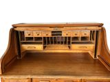 a wooden desk with drawers and drawers on it