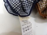 a label on a blue and white checkered scarf