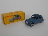 a small toy car sitting next to a box