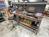 a workbench with a lot of tools on top of it