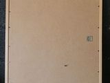 an empty piece of cardboard sitting on top of a table