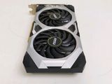a close up of a video card with a fan on top of it