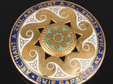 an image of a gold and blue medallion with a star