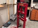 a red machine that is sitting in the corner of a room