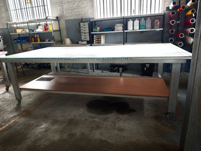 a white table with a wooden top in a room