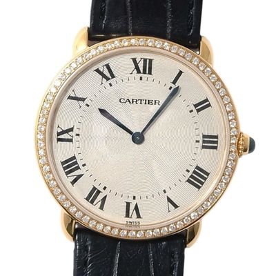 an image of a gold watch with roman numerals and diamonds