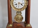 a clock that is sitting on top of a table