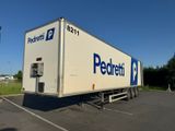 a semi truck that is parked in a parking lot