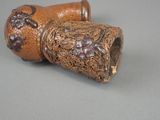 a small wooden object that is sitting on a table